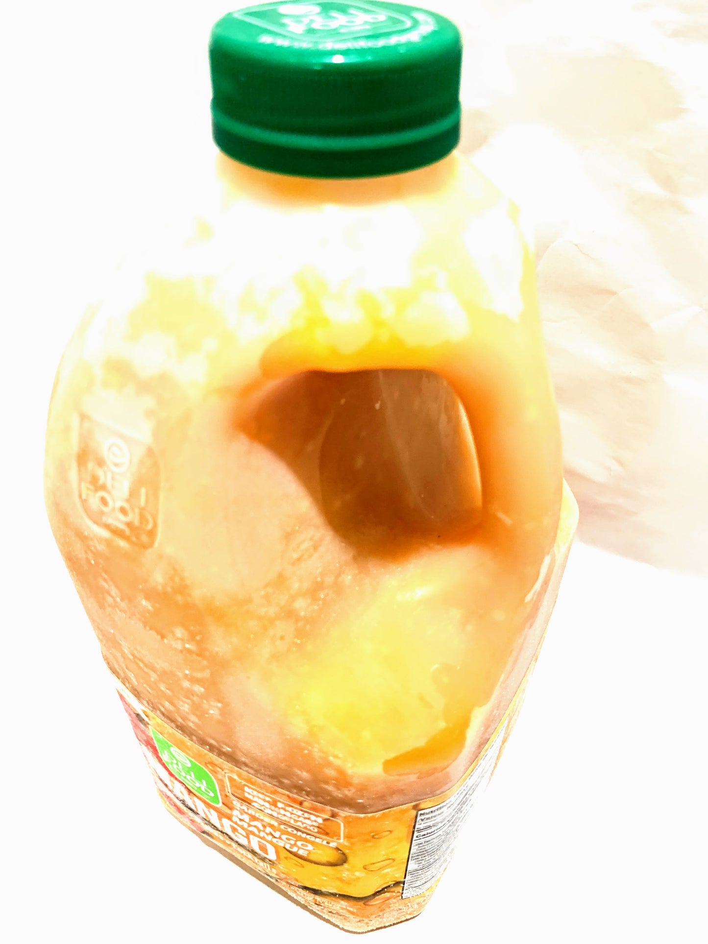 Mango 64oz plastic bottle of sweetened juice